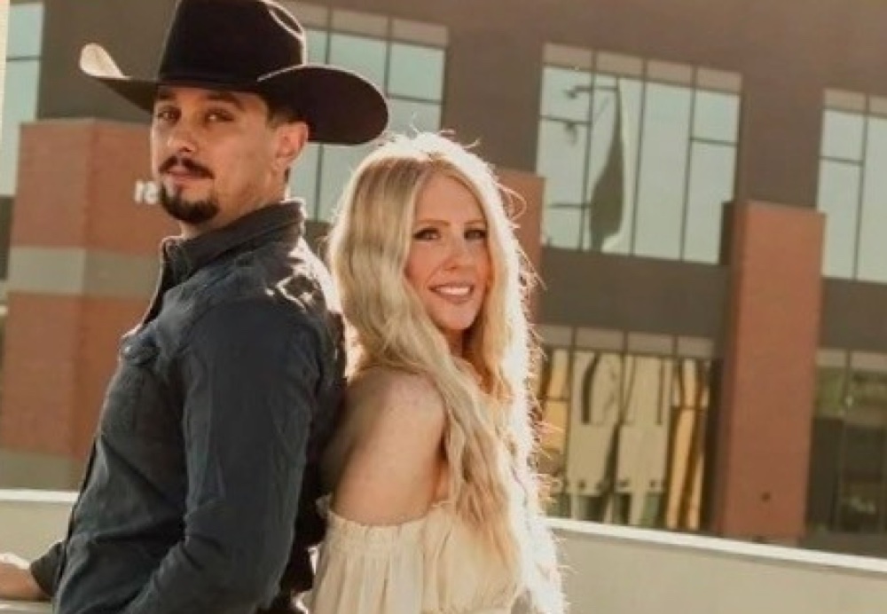 Nick Moody and Kristy Lynn standing back to back